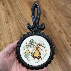 Cast‎ Iron Trivet, Ceramic Insert painted 'Dutch Girl Watering Flowers'